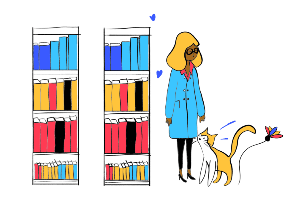 An illustration of 2 bookshelves filled with books and a brown-skinned woman standing by them. She is wearing a blue and red jacket, black trousers and glasses. She is reaching her hand out towards a cat. The atmosphere of the image is calm.
